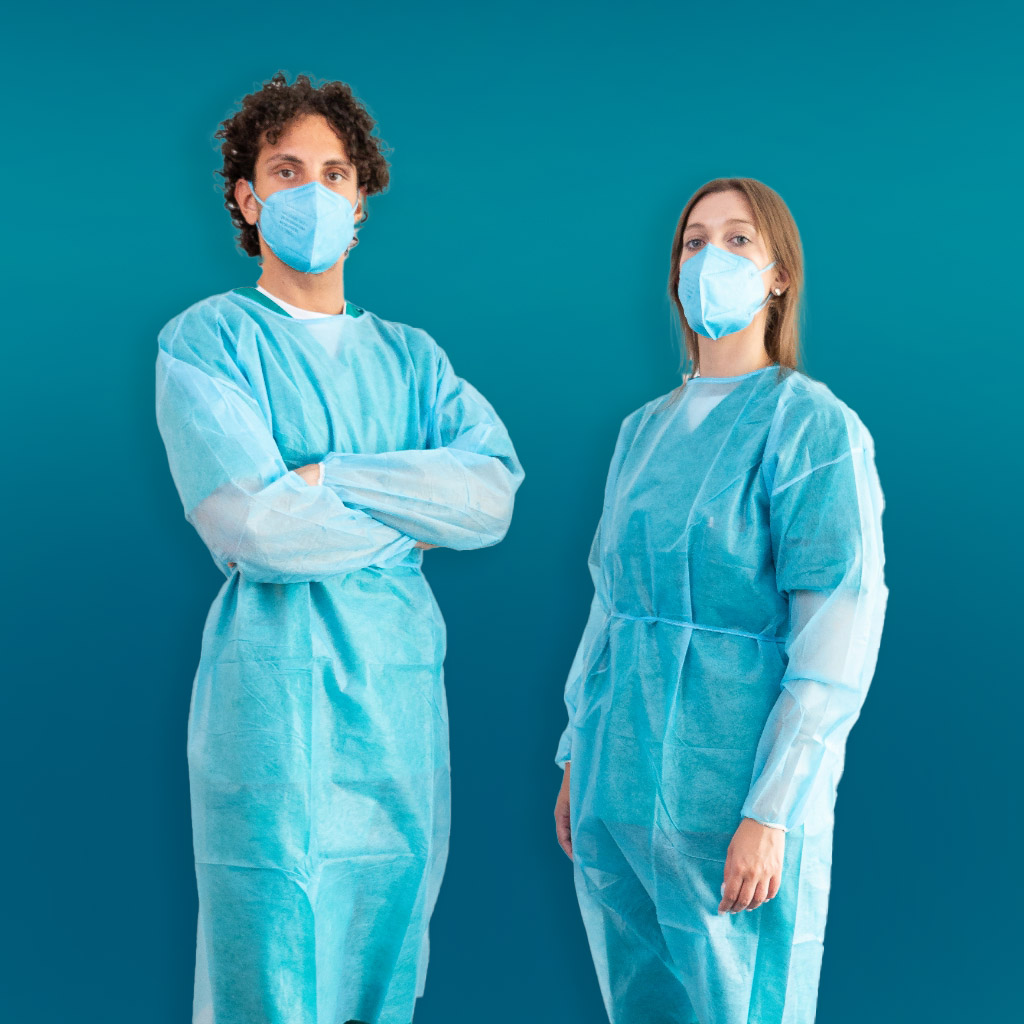 Young caucasian beautiful red haired girl wearing protective face mask,medical  gown and touch face with blue nitrile surgical gloves.Healthy care isolated  at home.Coronavirus protection.Copy space. Stock Photo | Adobe Stock